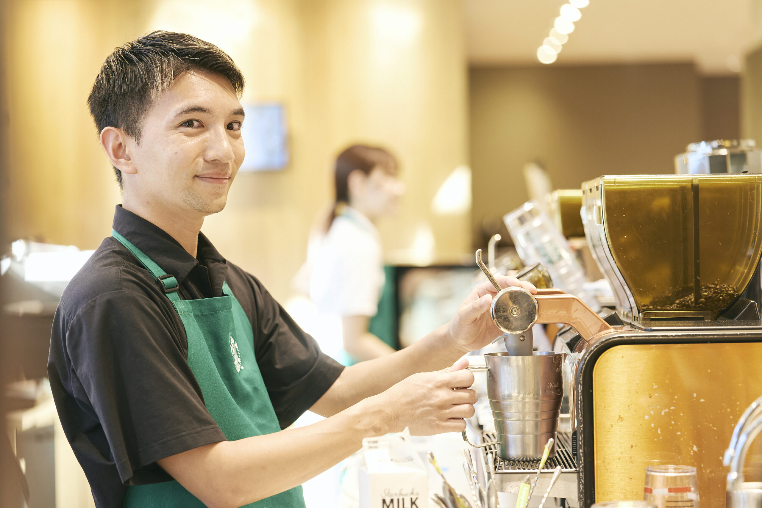 The photo of Satori making coffee at the store
