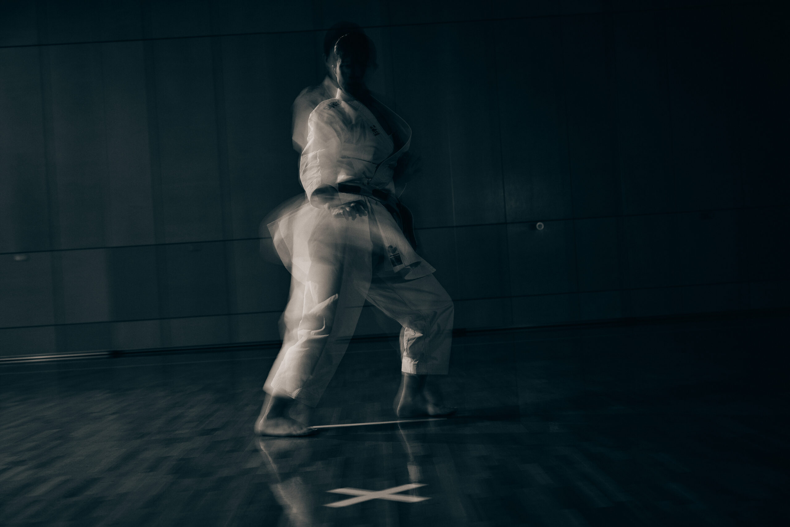 The photo of black and white photo of Ogura playing kata