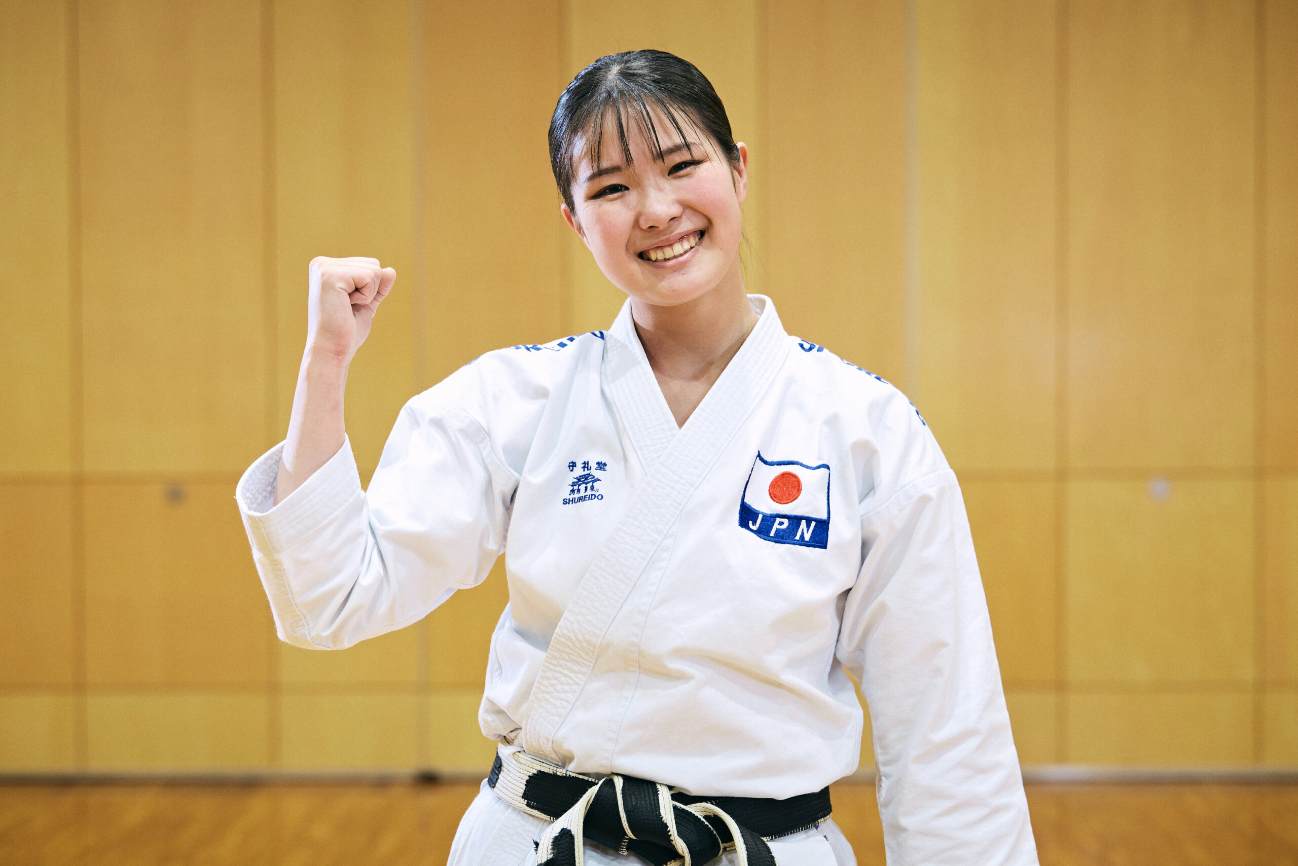 The photo of Ogura wearing her karate uniform and posing with guts.