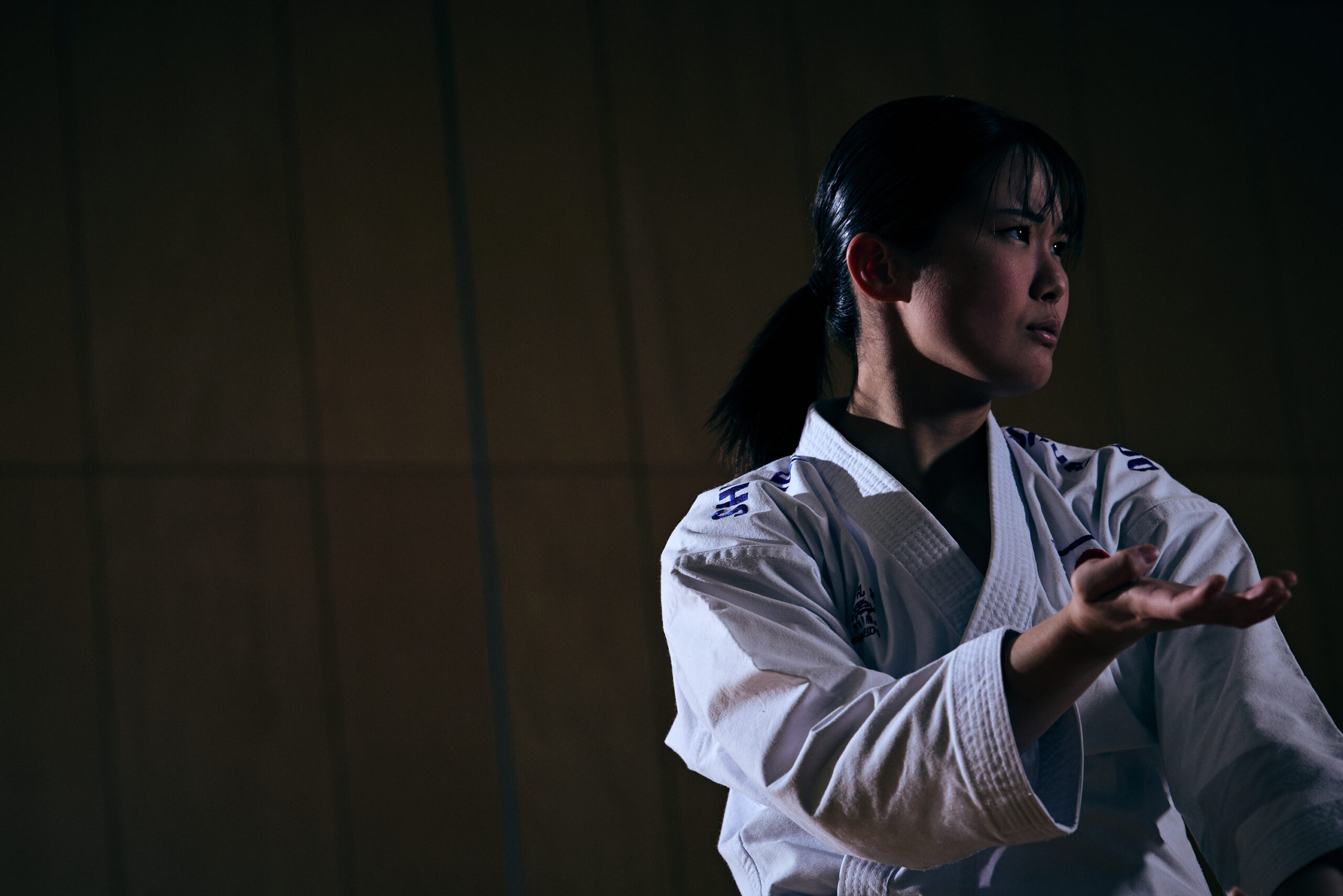 The photo of Ogura in karate pose.