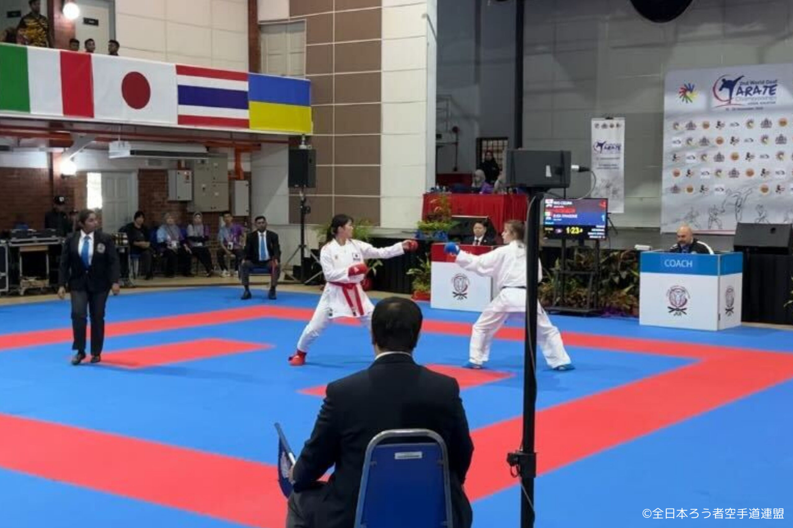 The photo of Ogura during a kumite match.